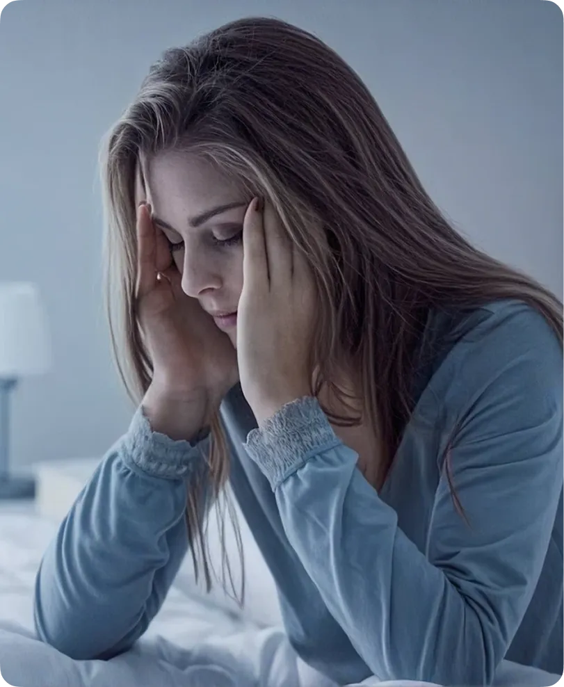 Women holding her head due to headache